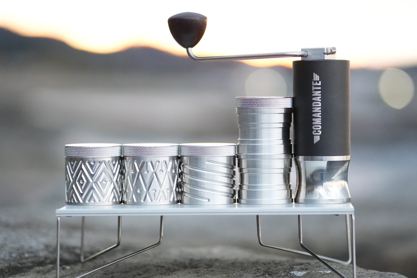 Three textured Megutokoubou canisters on a stove stand